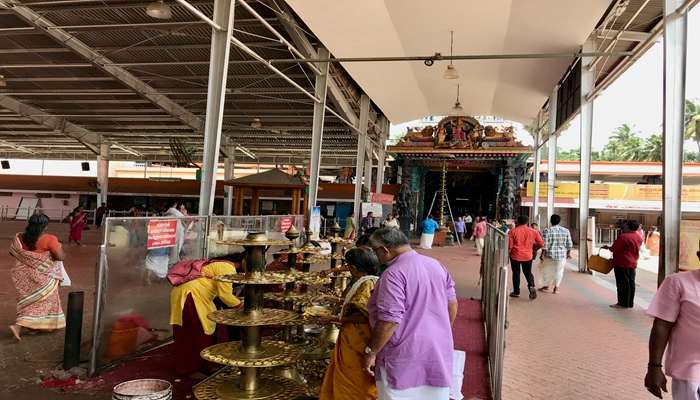 People lighting diyas in a Bhagavathy temple