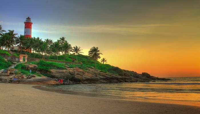 Places to Visit in Kerala with Family - Aerial view of Kovalam beach in Kerala with beautiful blue ocean and sandy shoreline, India.