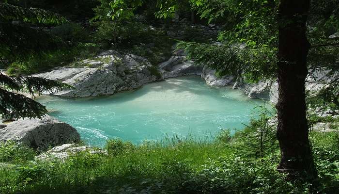 Splash around in natural swimming pool near Tegenungan Waterfall