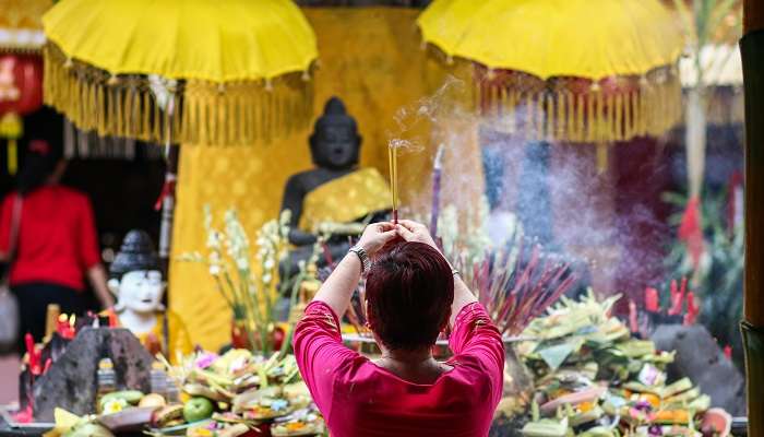 Woman Praying to Lord Buddha