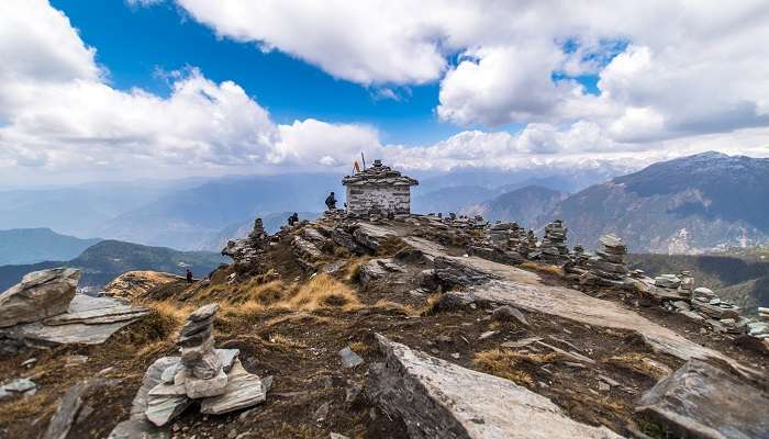 View of the Chadrashila temple at the top of the mountain peak