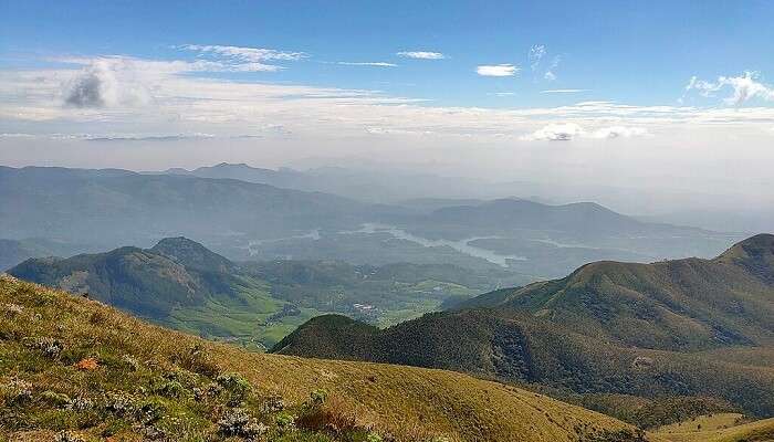 Enjoy sunrise at Meesapulimala Trek, a beautiful place near Tea Castle Resort Munnar.