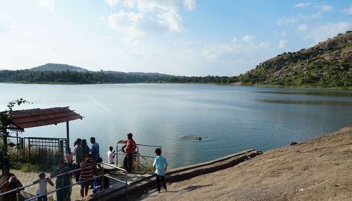 Explore the rocky landforms and ancient temples of Ramanagara near to the Dodda Aalada Mara.