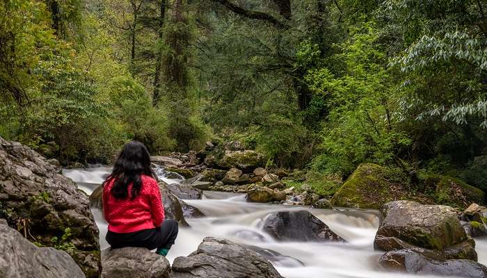 sit near the waterfall for a soothing experience.