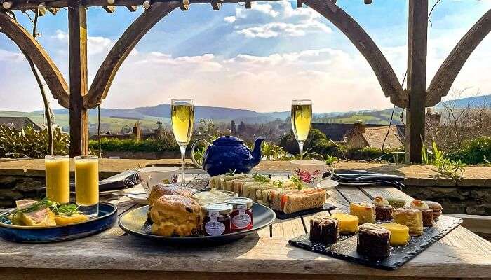 Relish exotic food with a beautiful view at Tea Castle Resort Munnar.
