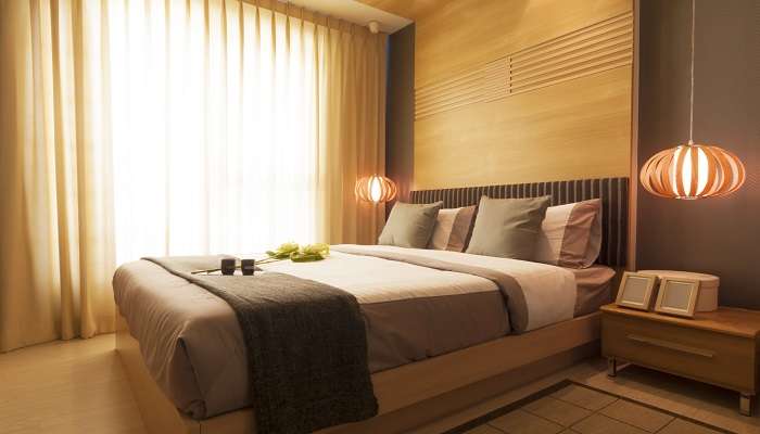 Cosy bedroom with dim lights and good ambience in Ashtamudi Resorts