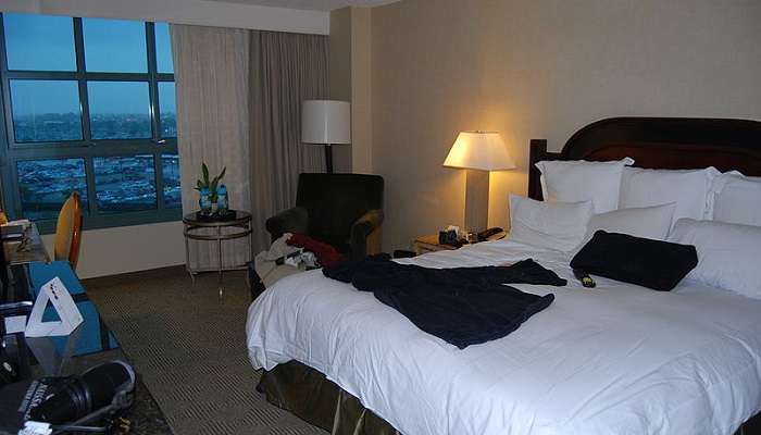 A cosy and modern hotel room with dim yellow lights