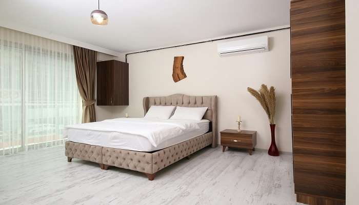 A room with a double bed in a hotel room