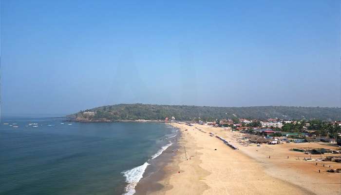 Parasailing activity on Baga Beach to visit near the Mandrem Beach.