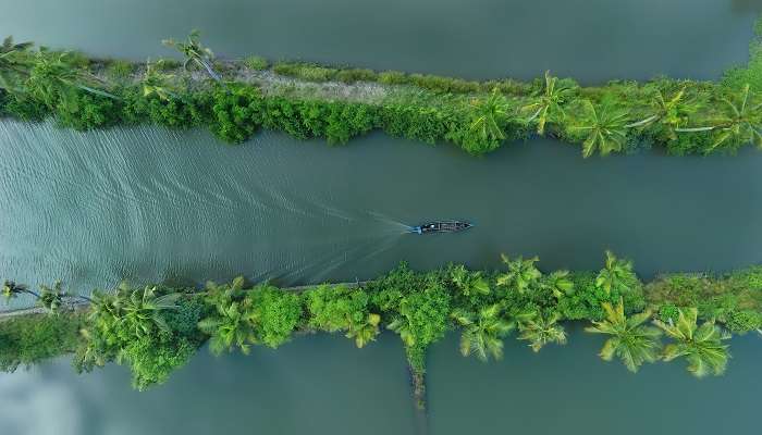 Aerial shot boat at Alleppey (Alappuzha) Kumarakom backwaters in Kerala, places to visit in winter in India