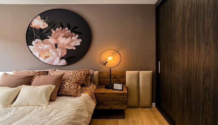 Floral Painting Hanging above Bed in Hotel Rooms