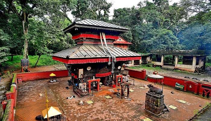 Bajrabarahi temple in Kathmandu surrounded by lush greenery. 