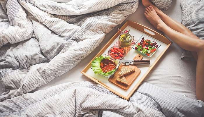 Breakfast in bed at hotel room