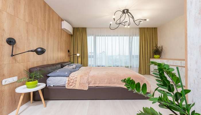 Brown Bed with Brown Blanket in a Beautiful Hotel Room