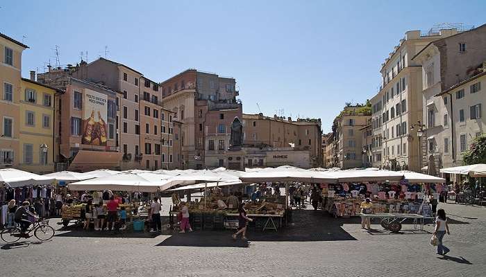 Campo de Fiori market with the statue of Giordano Bruno in the background.