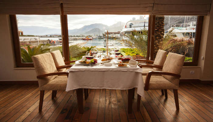 View of perfect dining table with wine glasses