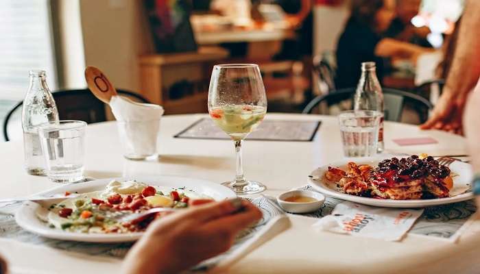 View of people enjoying wine at the table