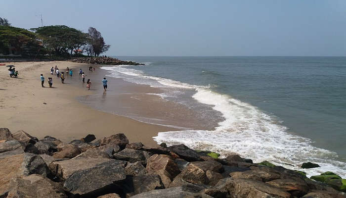 Tides are crashing along the rocks at Fort Kochi Beach.