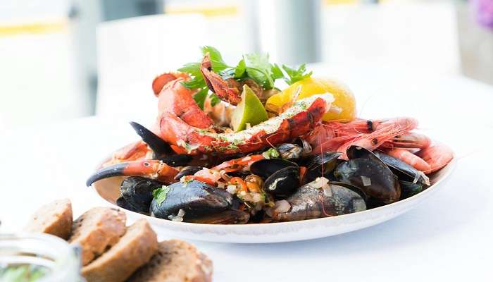 Shrimp salad with a side of bread at the best Restaurants in Rockhampton.