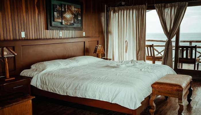 A decorated bed in a room.