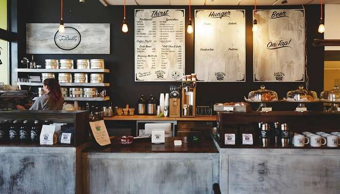 Woman standing in a coffeehouse