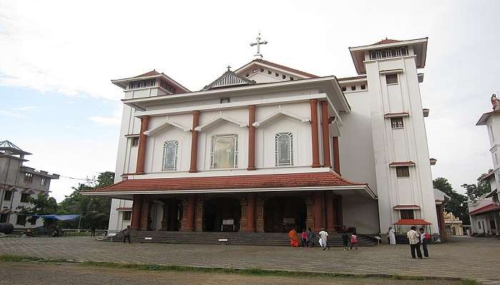 People pray at holy cross at the hills of Malayattoor Church 