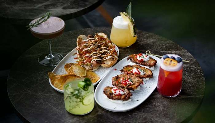 Artisanal cocktails and dishes on the table