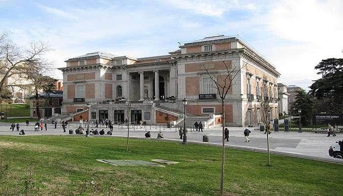 The grand façade of the Prado Museum in Madrid near El Retiro Park.