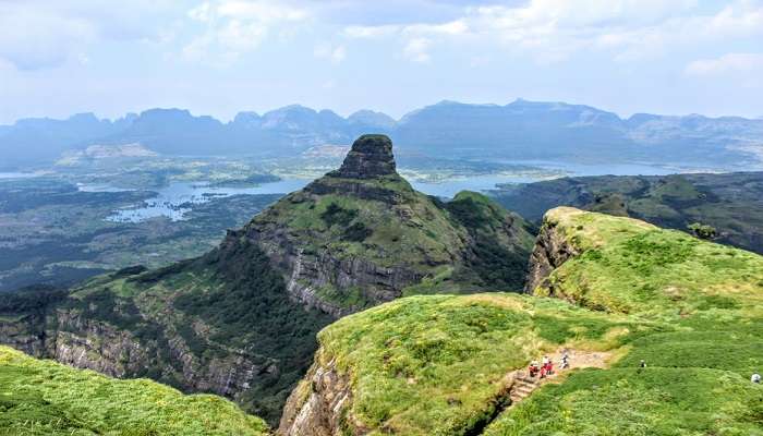  Breathtaking view of Ratangadh fort, a scenic tourist attraction near Randha falls.