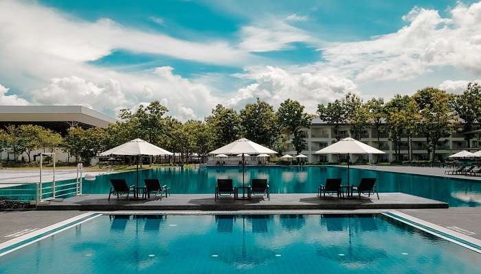 Blue sky with clouds overlooking pool area