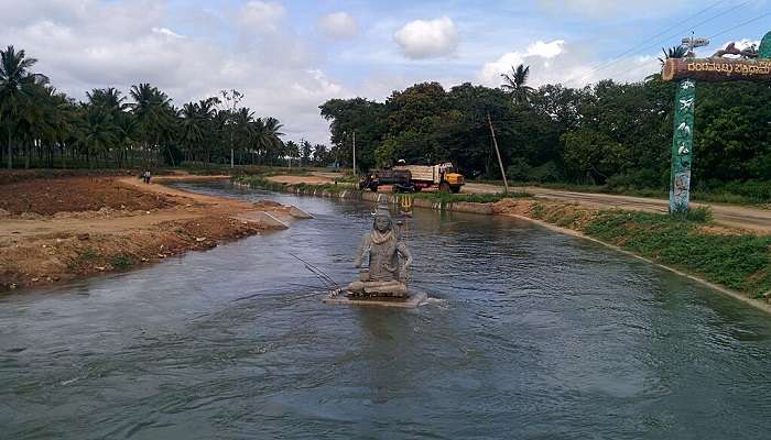 A statue of Lord Shiva in the waters.