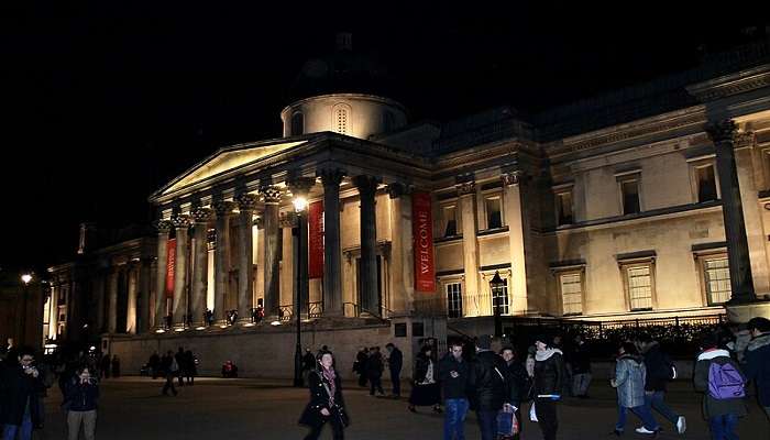 The front view of the National Gallery at night near the British Museum.