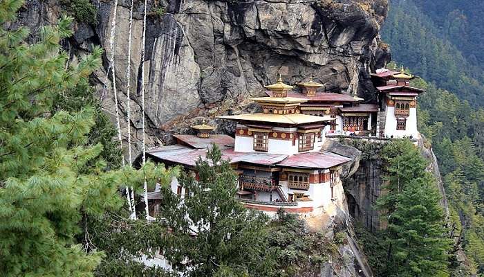 View of Paro Taktsang monastery amidst lush green backdrop