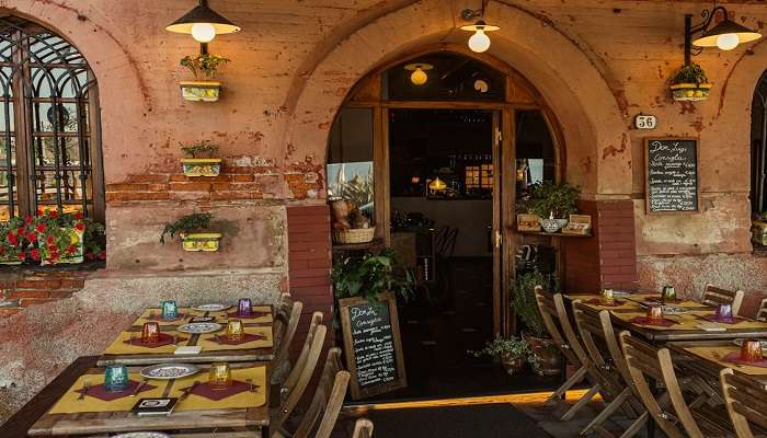 Tables and an Entrance to have the delicious food. 