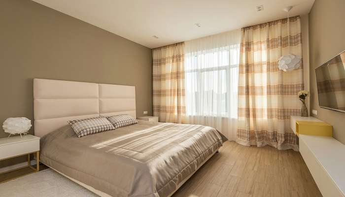 A cosy bedroom with a brown theme