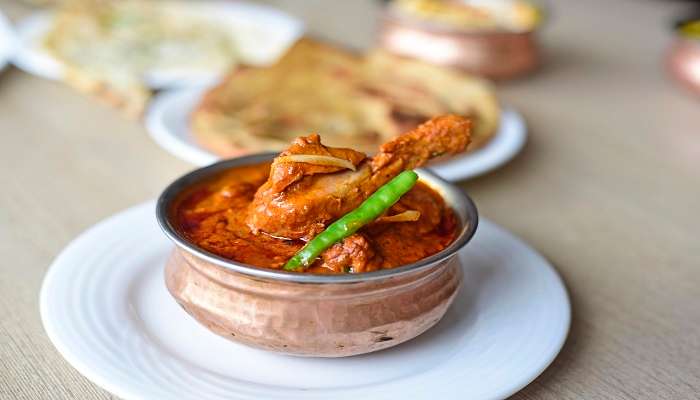 A generous portion of Chicken curry, an Indian delicacy