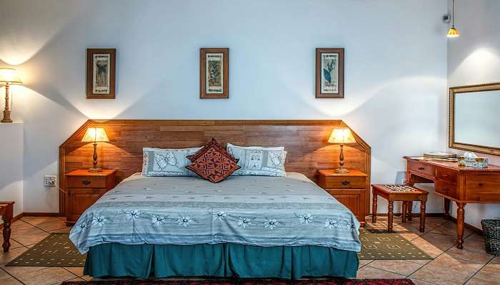 Spacious bedroom of Bopaiah's Inn in Coorg near Dubare Elephant Camp.