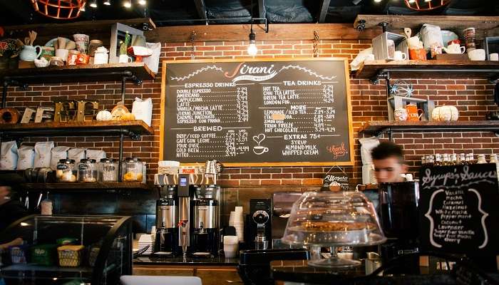 Barista brewing coffee in a coffee shop 