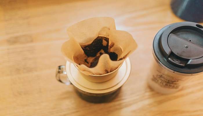 Cups and Glasses on a Wooden Table at the best cafes in Albury.