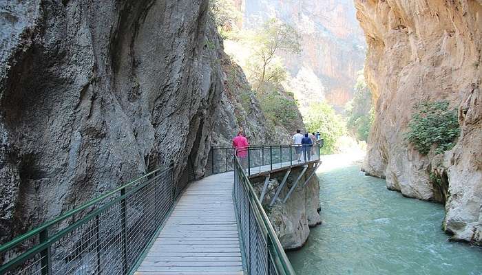 Group of people enjoying a canyoning experience at Saklikent National Park.