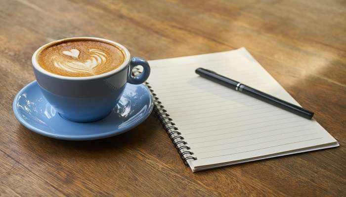 Coffee on Saucer Beside the Notebook at the best cafes in Albury.