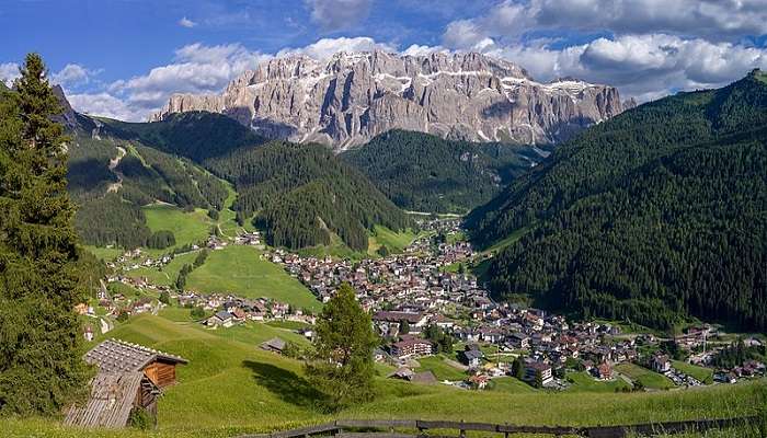 Lush green panoramic view of the Selva di Val Gardena and Dolomite ranges