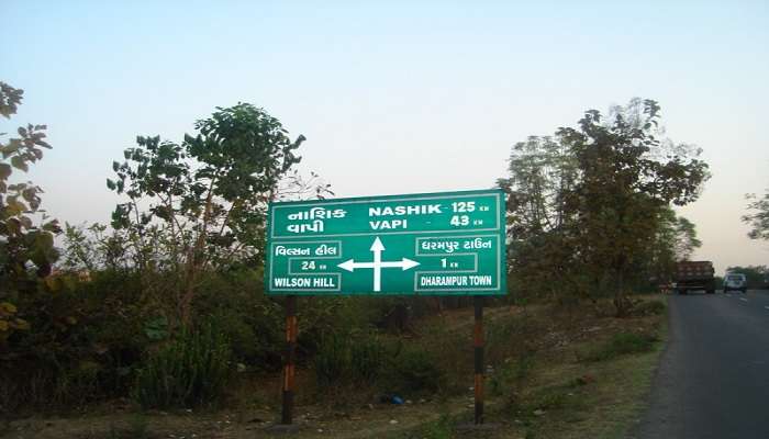 Sign board with directions to Wilson Hills 