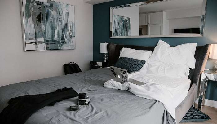 A messy bed in a hotel room in Kotdwar.