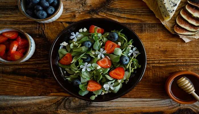 A plate of salad with herbs