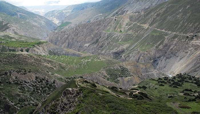 Rugged trekking trail passing through striking valleys and mountains in Jomsom Nepal.