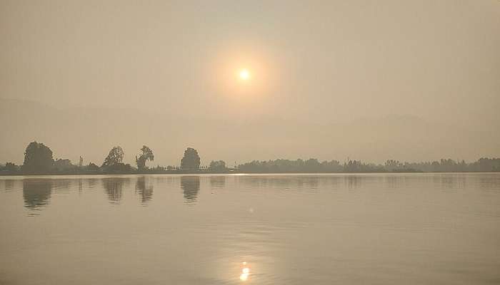 Tourists visit the Nigeen Lake to witness the picturesque sunset