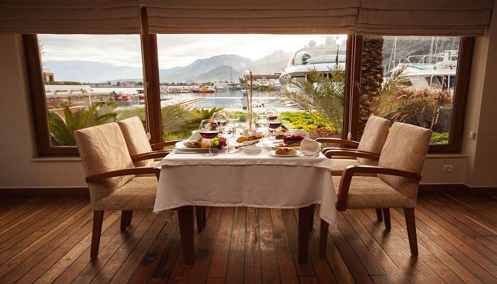 View of perfect dining table with wine glasses