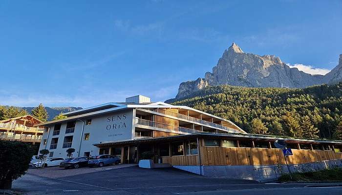 Panoramic view of Hotel Sensoria nestled on the mountain range, on a clear day