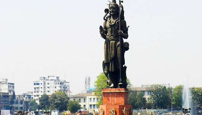 A black shiva statue at the Sur Sagar Lake in Vadodara, Gujarat.